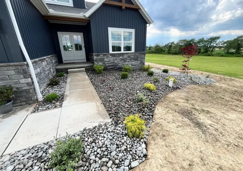 Front entry decorative stone bed and new plantings installed by Going Yard