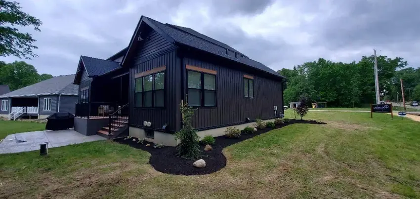 Modern home landscape installation with mulch bed and lawn by Going Yard